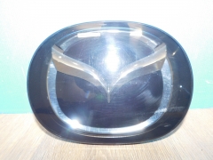 Эмблема передняя Mazda CX5 17- TK7951730